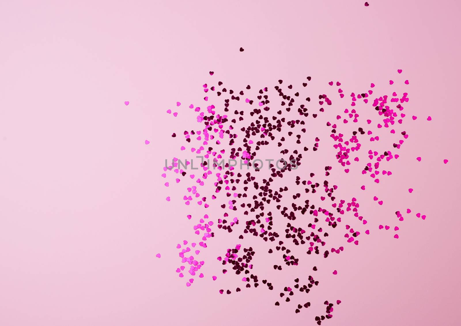shiny pink confetti on a pink background, festive backdrop for birthday, valentines day. Festive decoration element. Flat design 