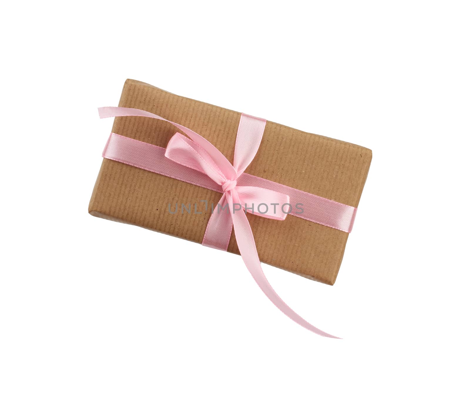 rectangular box wrapped in brown kraft paper and tied with a pink ribbon, gift isolated on a white background, element for a designer