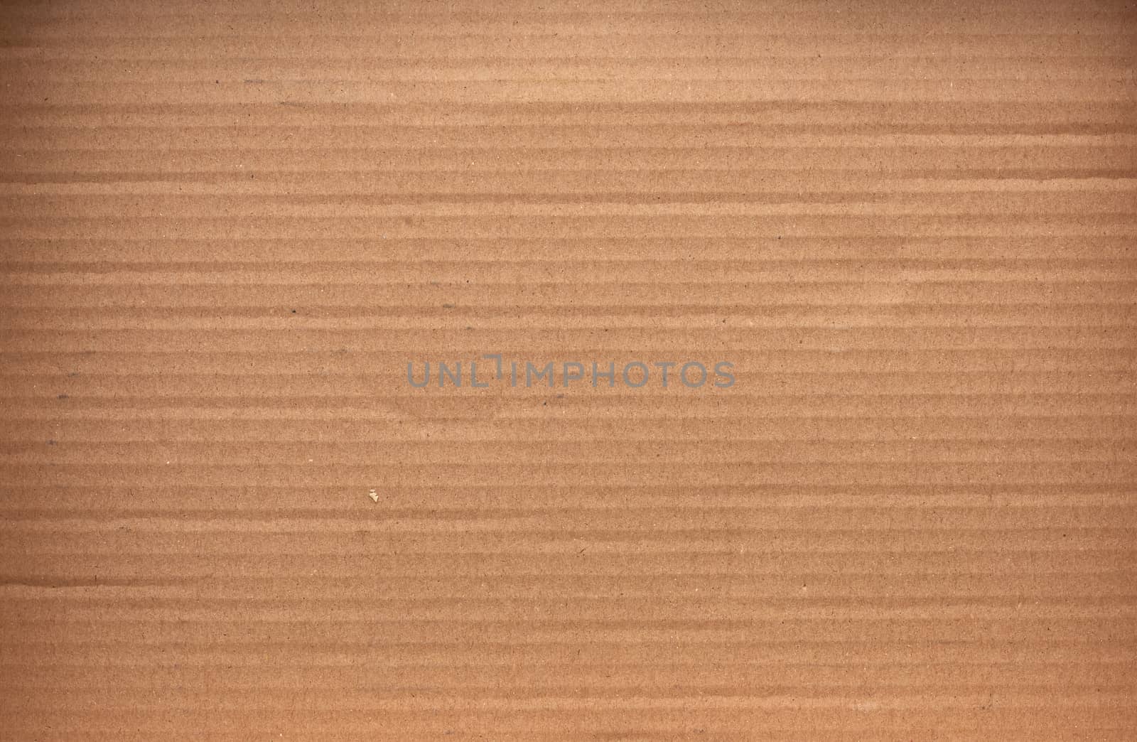 piece of smooth brown cardboard paper, full frame, close up