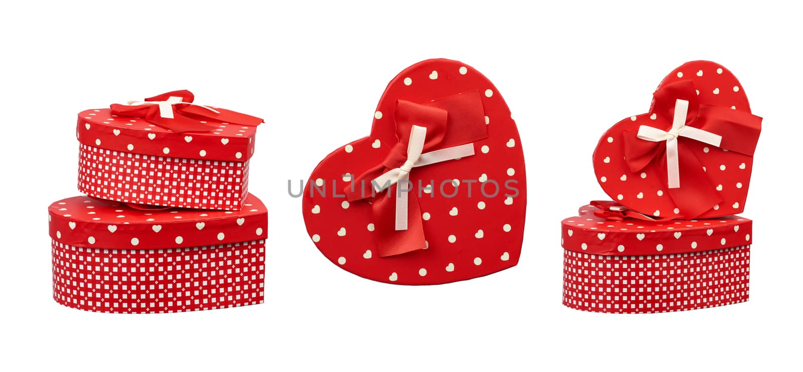 set of red heart-shaped cardboard boxes in white polka dots, gifts are isolated on a white background