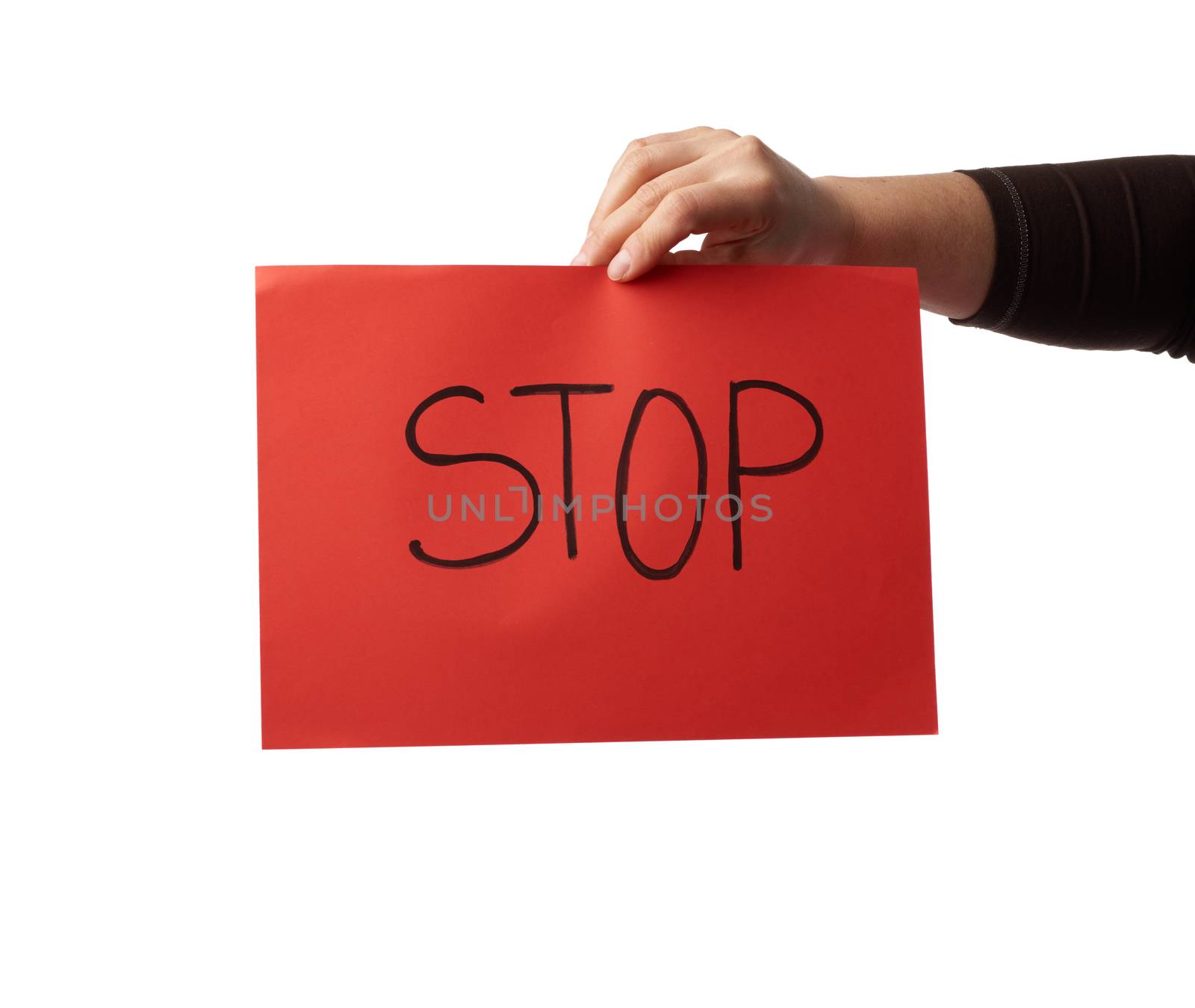 female hand holds a red sheet of paper with the inscription stop, do not panic concept