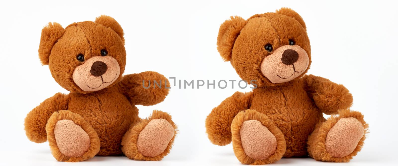 cute brown little vintage teddy bear sitting on a white background, traditional children's toy