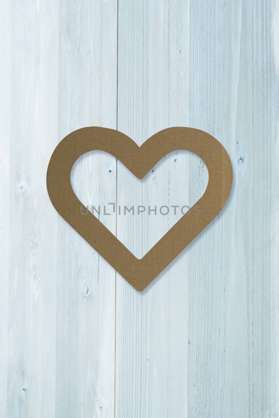 heart against bleached wooden planks background