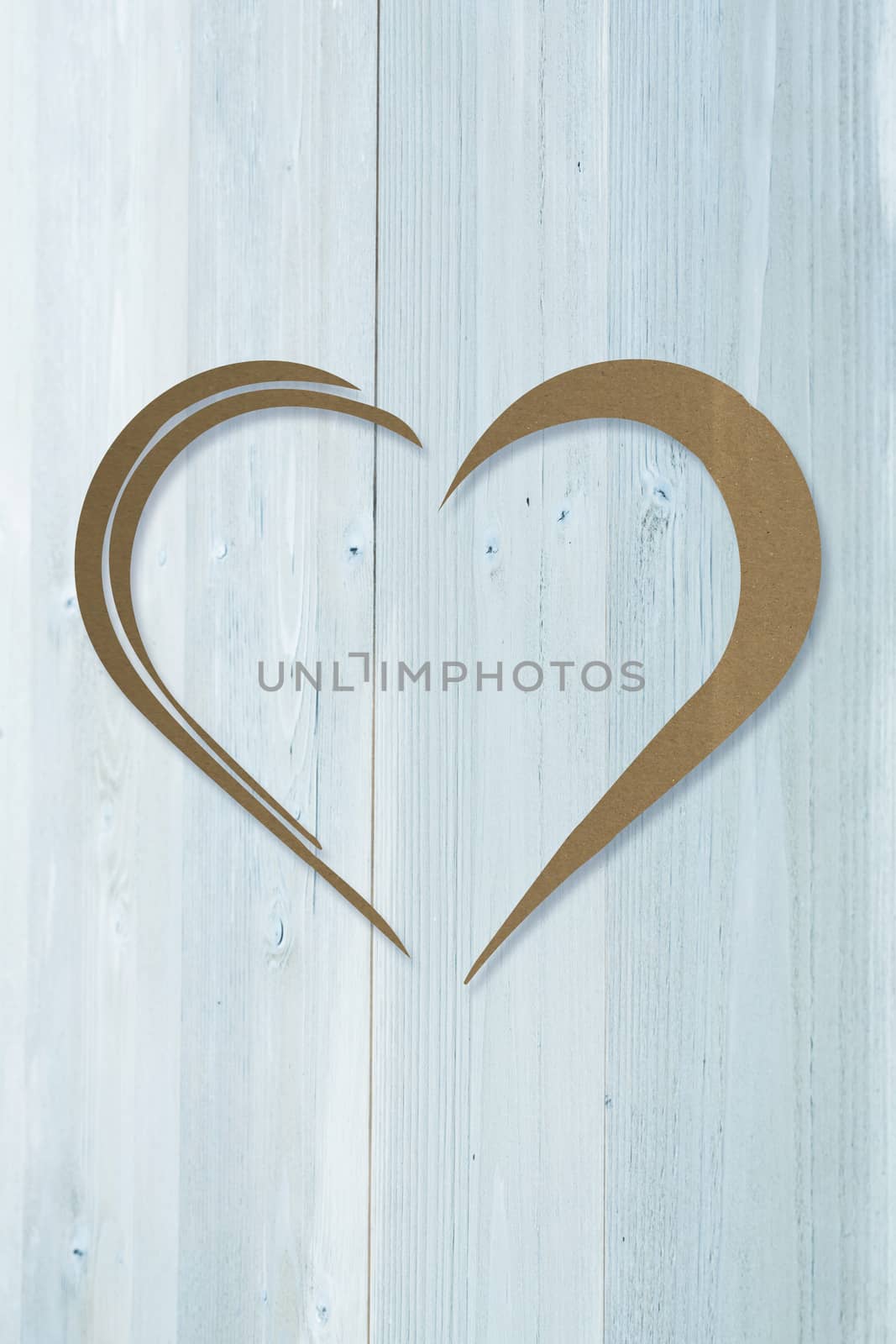 Heart against bleached wooden planks background