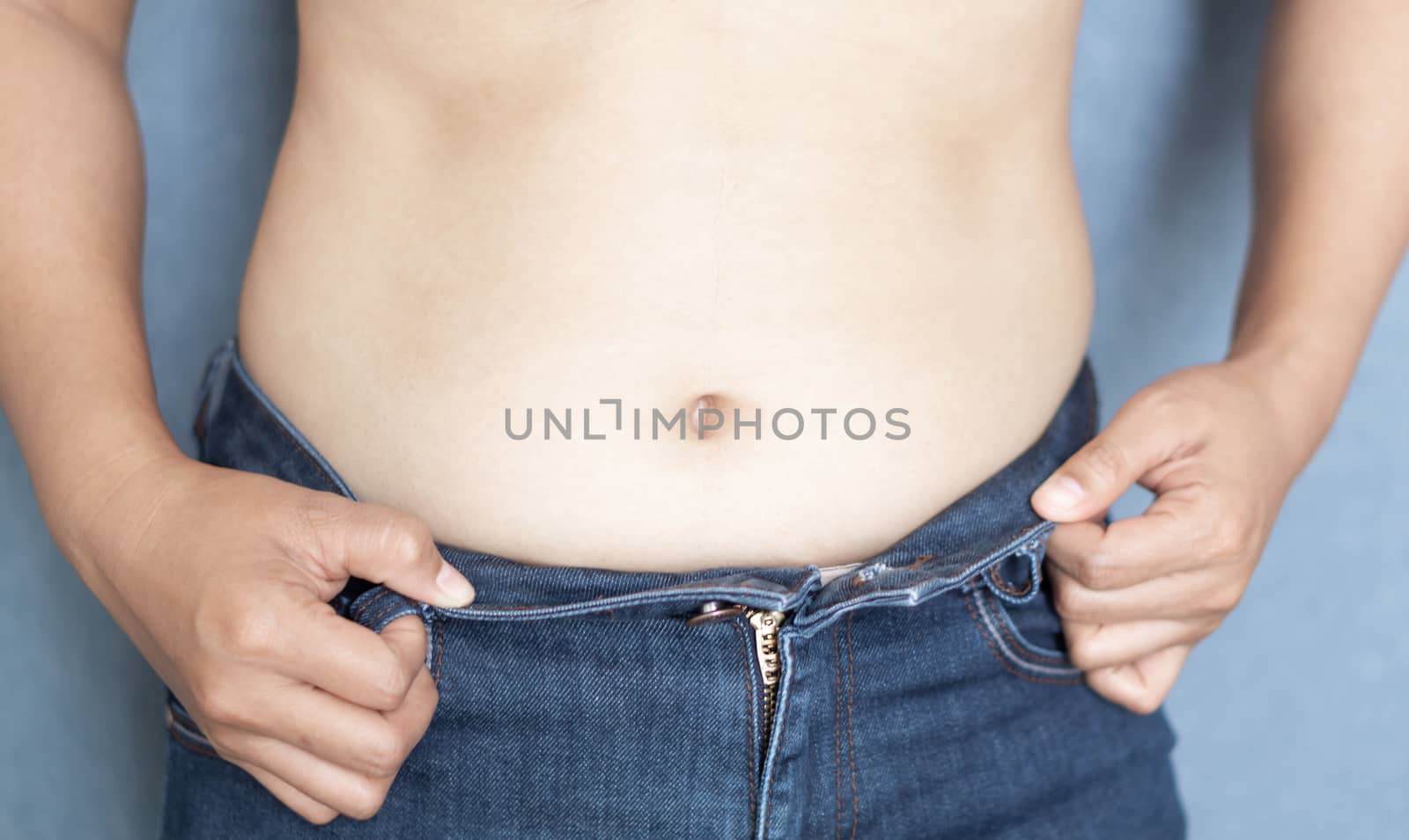 Closeup abdominal surface woman fat, healthy care and beauty concept