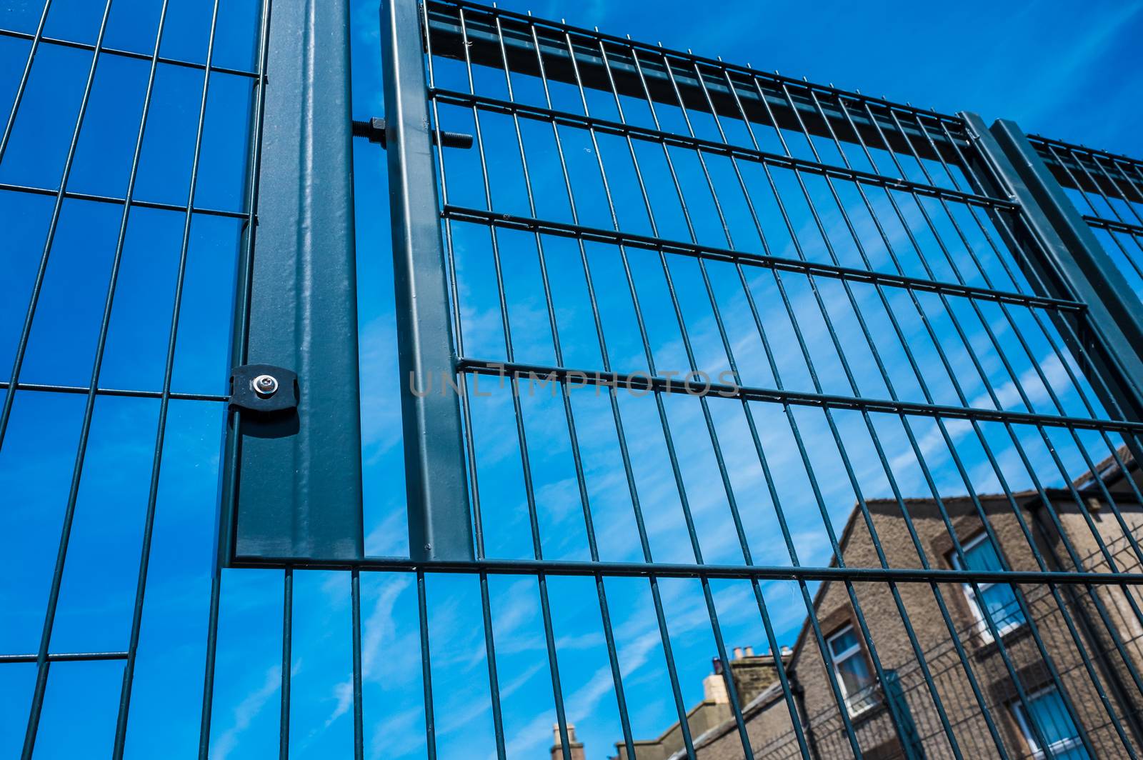 Black metal security gates protecting business property