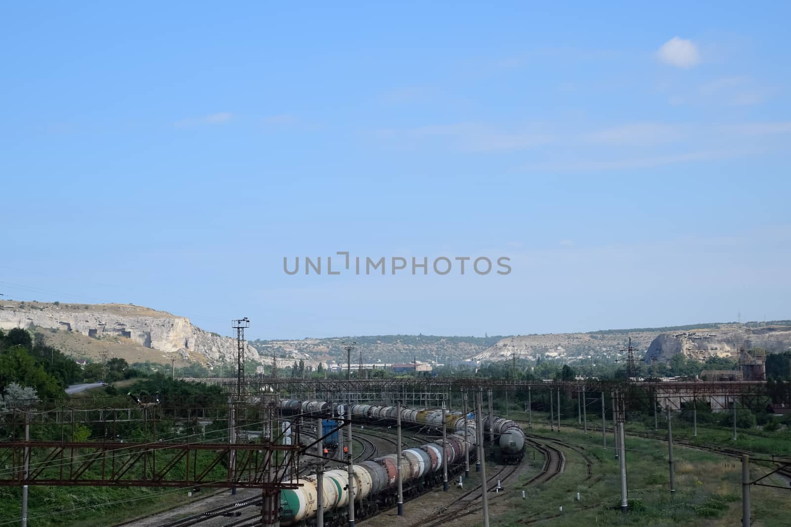 Railroad tracks opposite ancient quarry. by fedoseevaolga