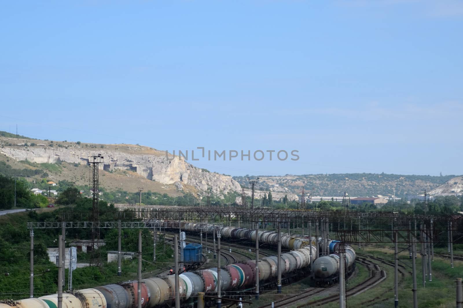 Railroad tracks opposite ancient quarry. by fedoseevaolga