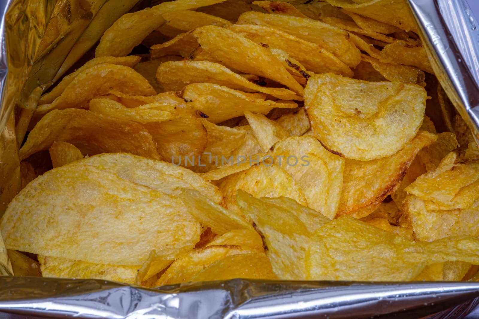 Chips in aluminum paper bag, food photography