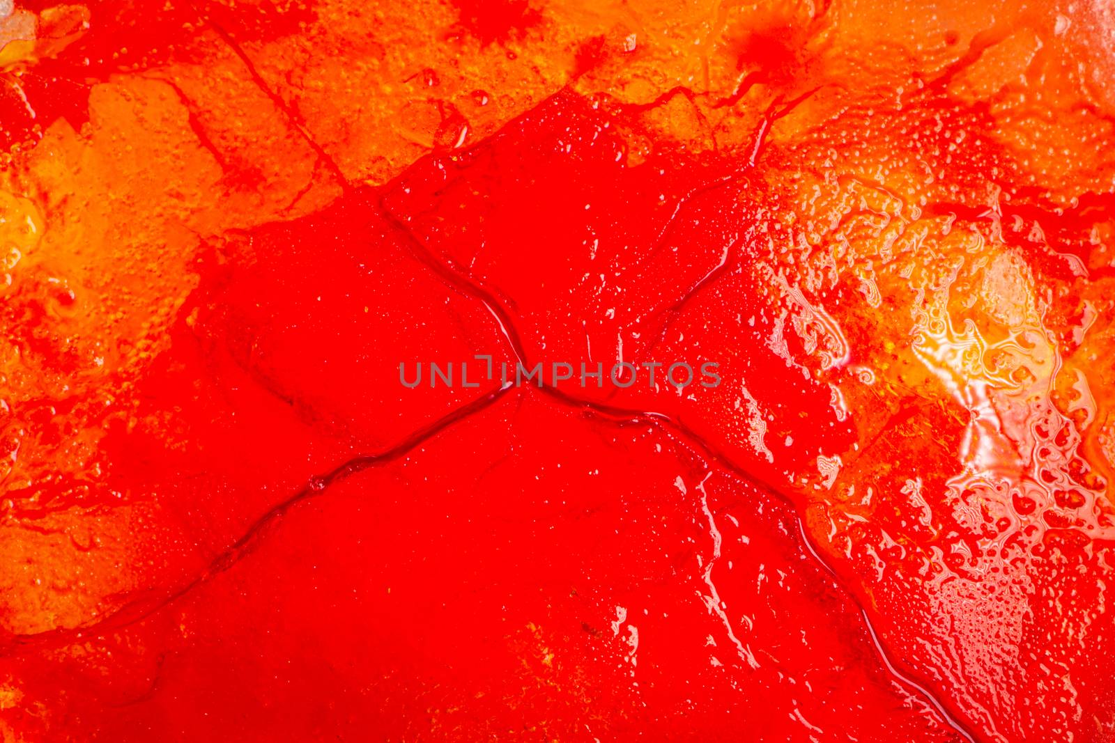 Image of blood-colored liquids mixed with other organic fluids, abstract chemical detail