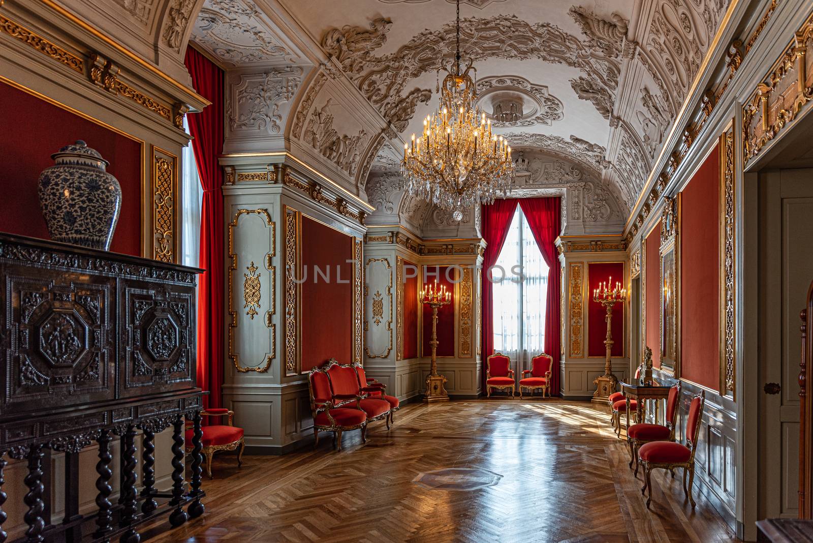 Interiors of royal halls in Christiansborg Palace in Copenhagen Denmark, corridor with antique furniture and paintings