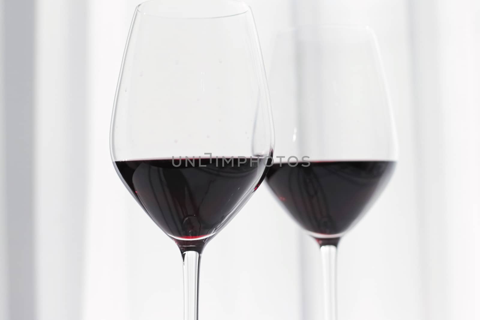 Two crystal glasses of red wine, organic beverage product