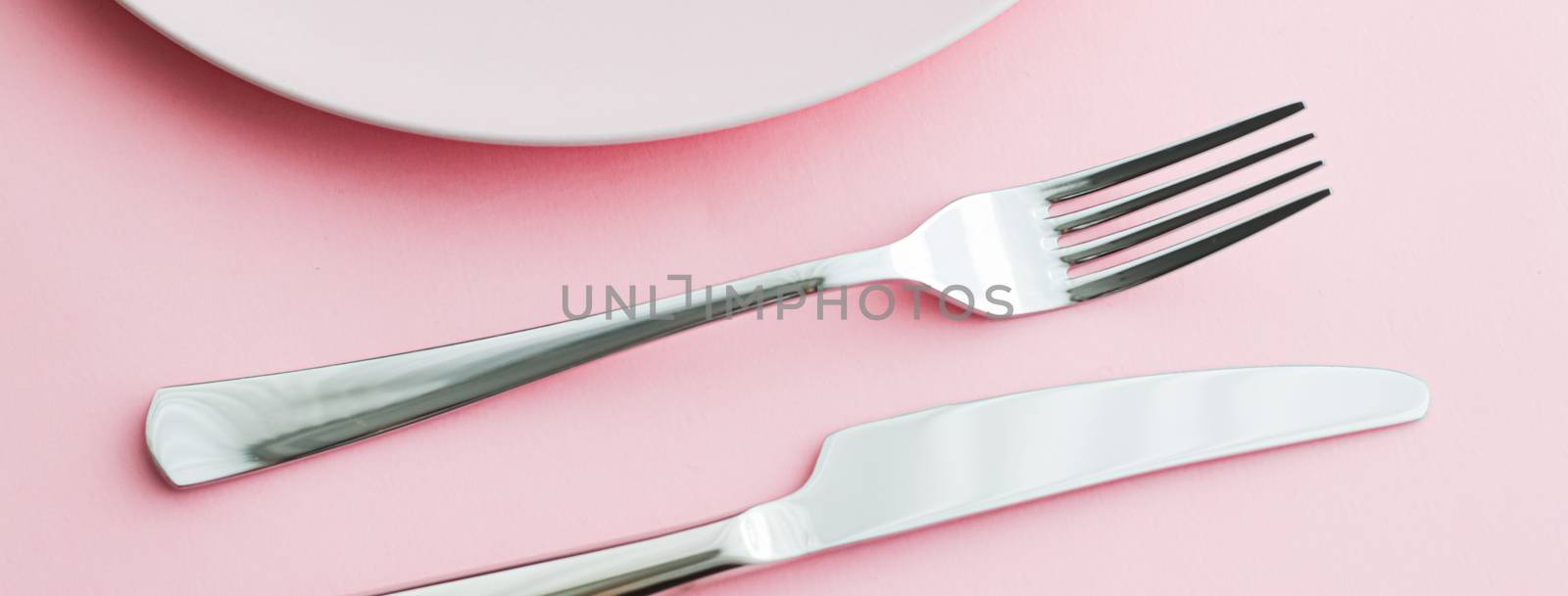 Empty plate and cutlery as mockup set on pink background, top tableware for chef table decor and menu branding by Anneleven