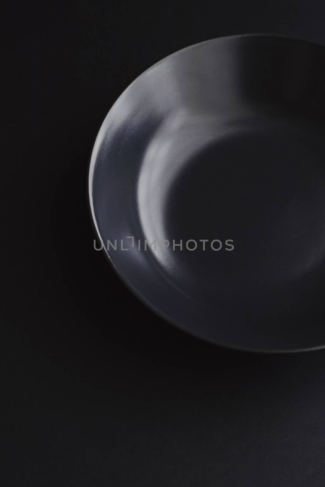 Empty plates on black background, premium dishware for holiday dinner, minimalistic design and diet by Anneleven