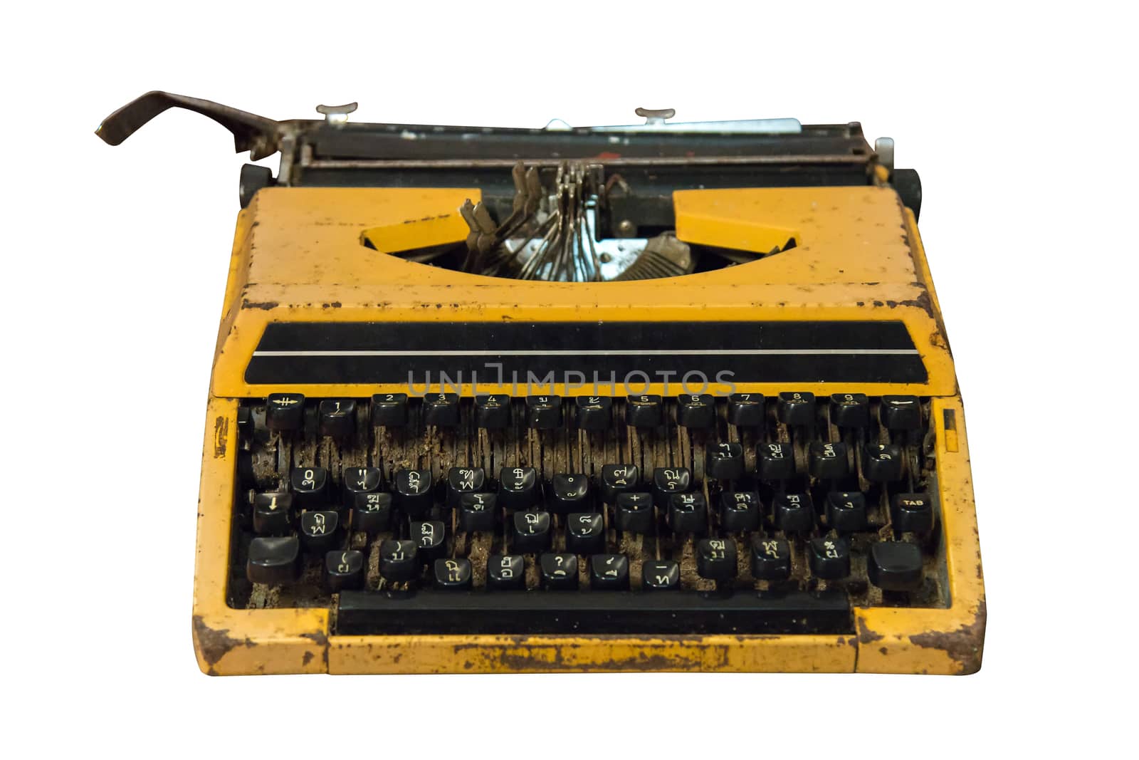 Rusty old vintage yellow typewriter isolated. by NuwatPhoto