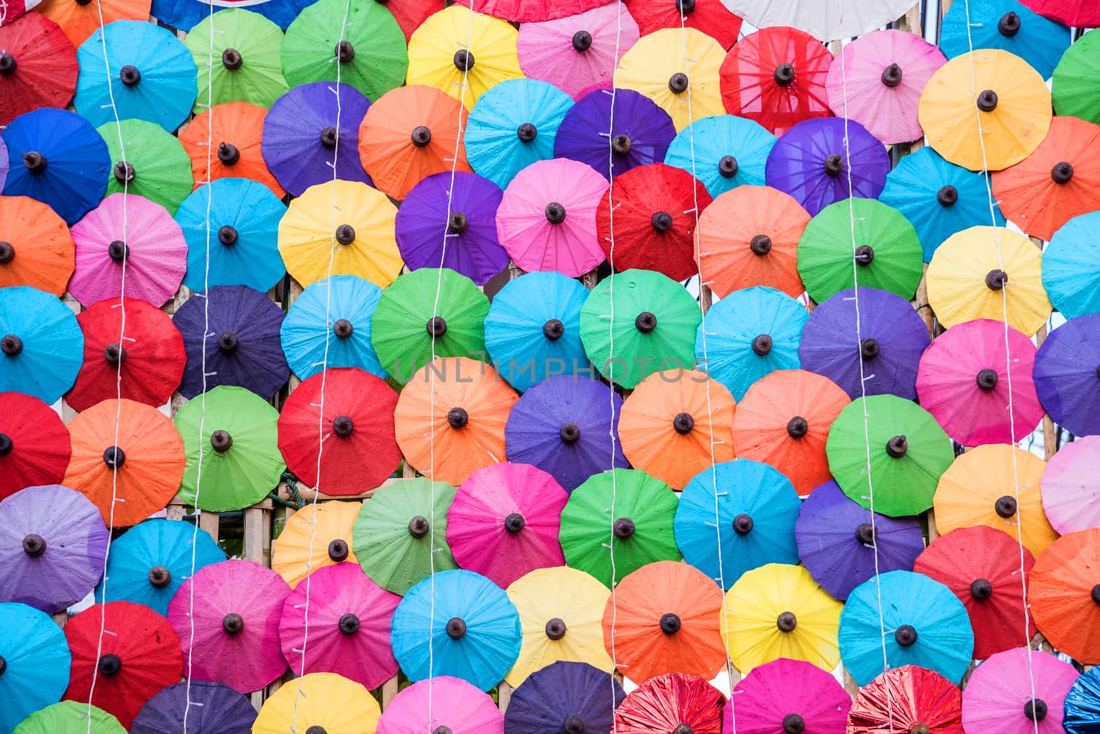 The colorful paper umbrellas handmade. by NuwatPhoto