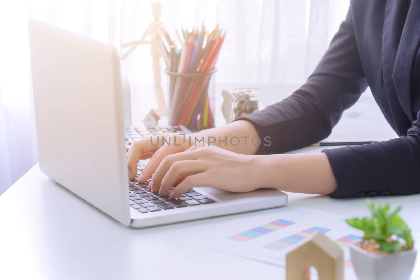 A young business woman using laptop computer on the table, Looking for direction and inspiration.