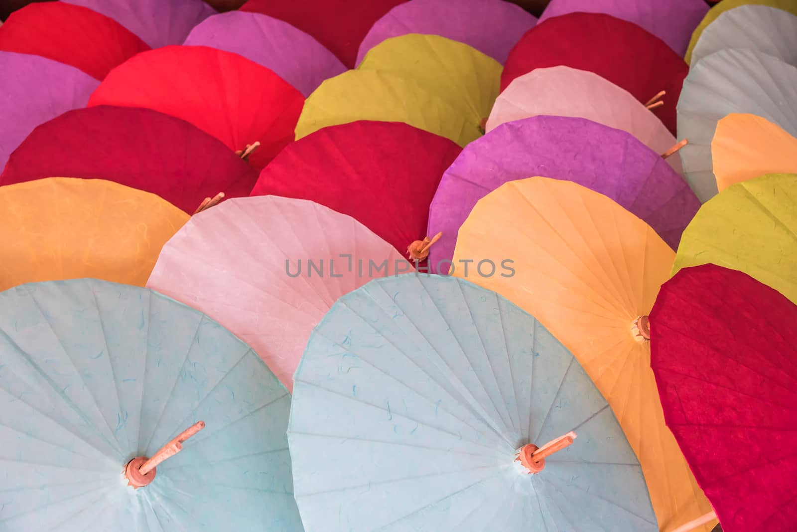 The colorful paper umbrellas handmade. by NuwatPhoto