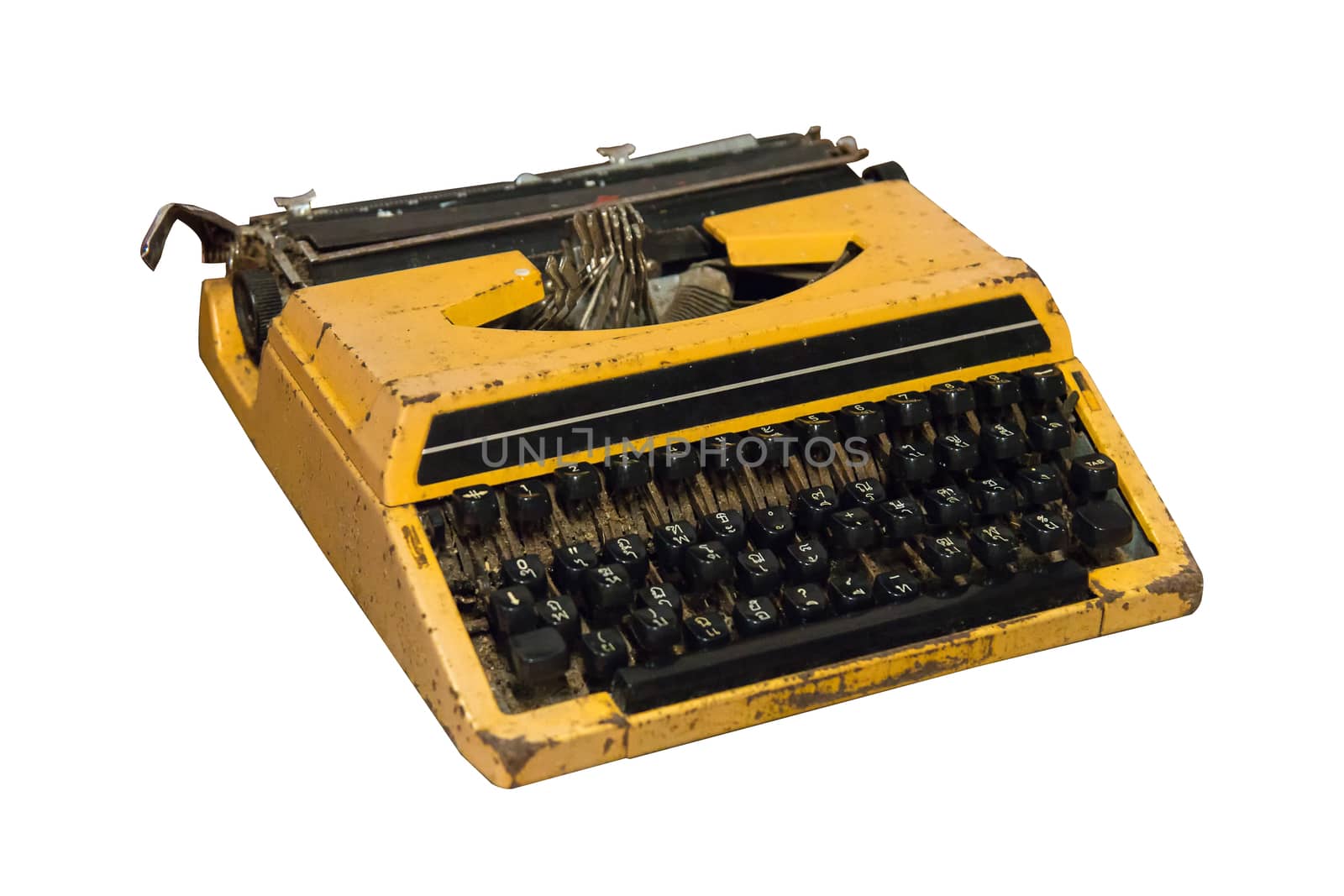 Rusty old vintage yellow typewriter isolated on white background, work with clipping path.