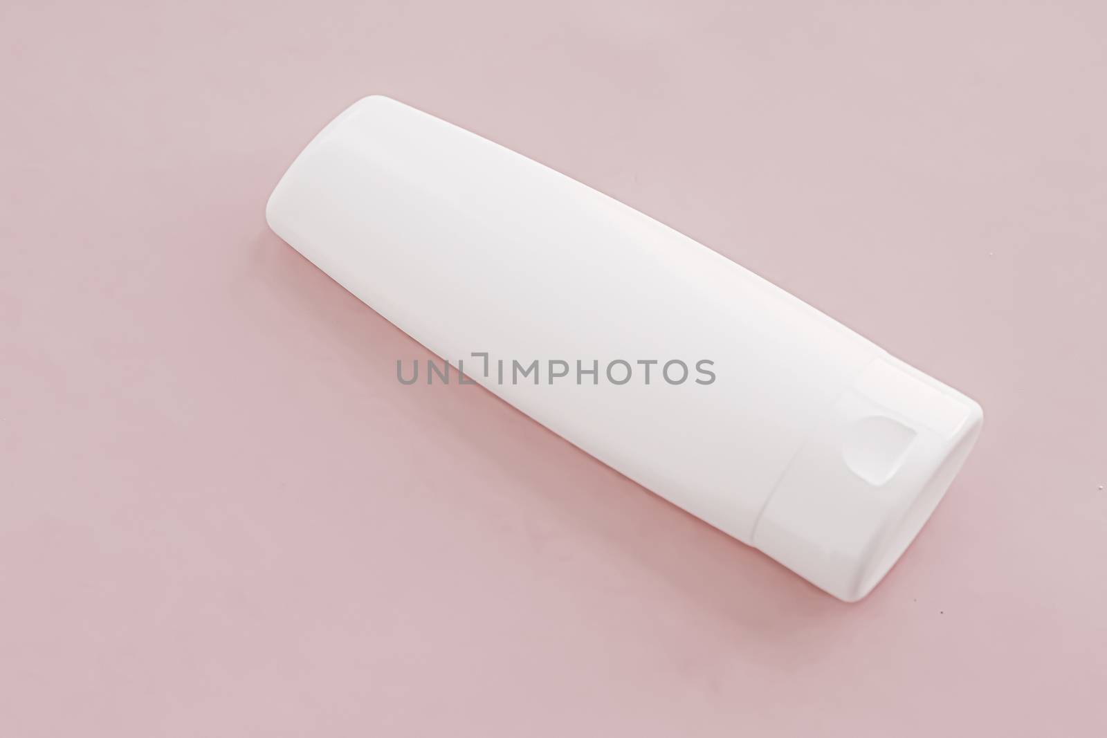 Moisturizing hand cream or body lotion on pink background, beauty product and skin care cosmetics, flatlay