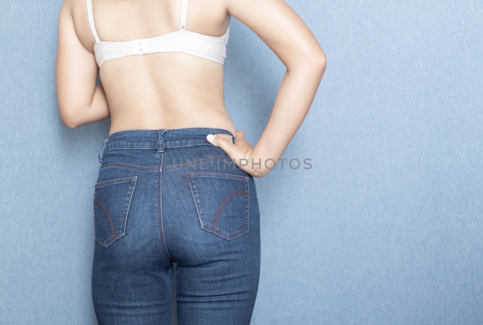 Woman showing jeans pants and body after weight loss and sexy body