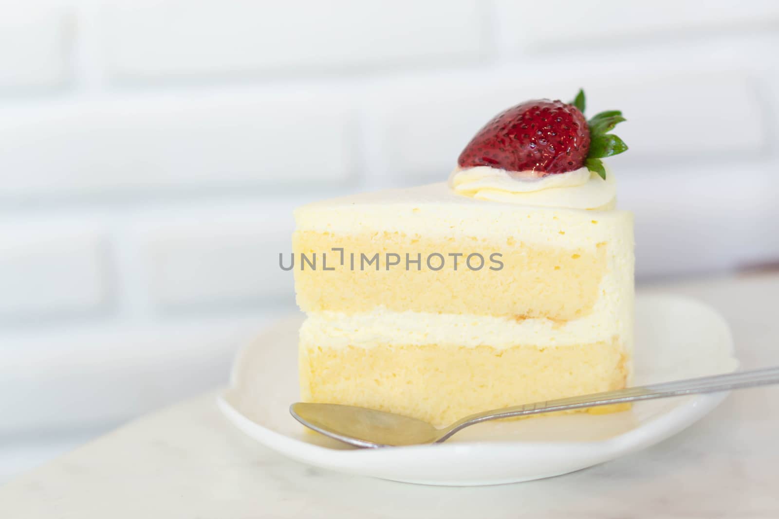 Closeup Milk cake delicious on glass table background, selective focus