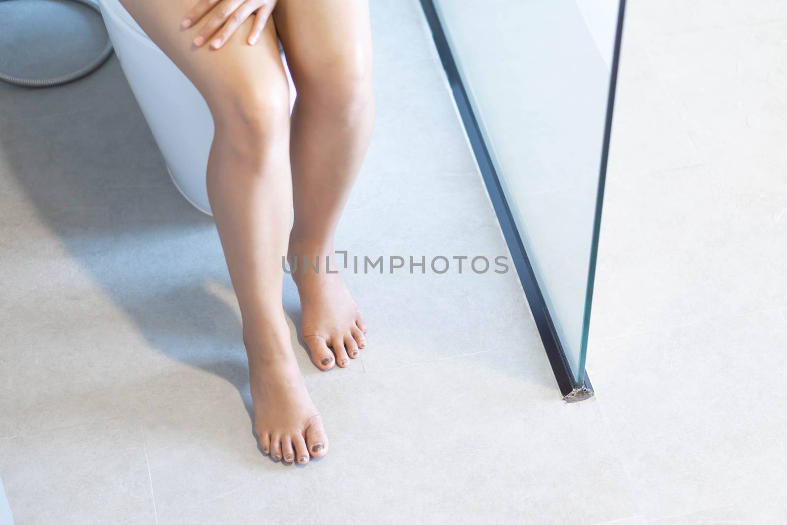 Close up woman stomachache with toilet in the morning, health care concept, selective focus