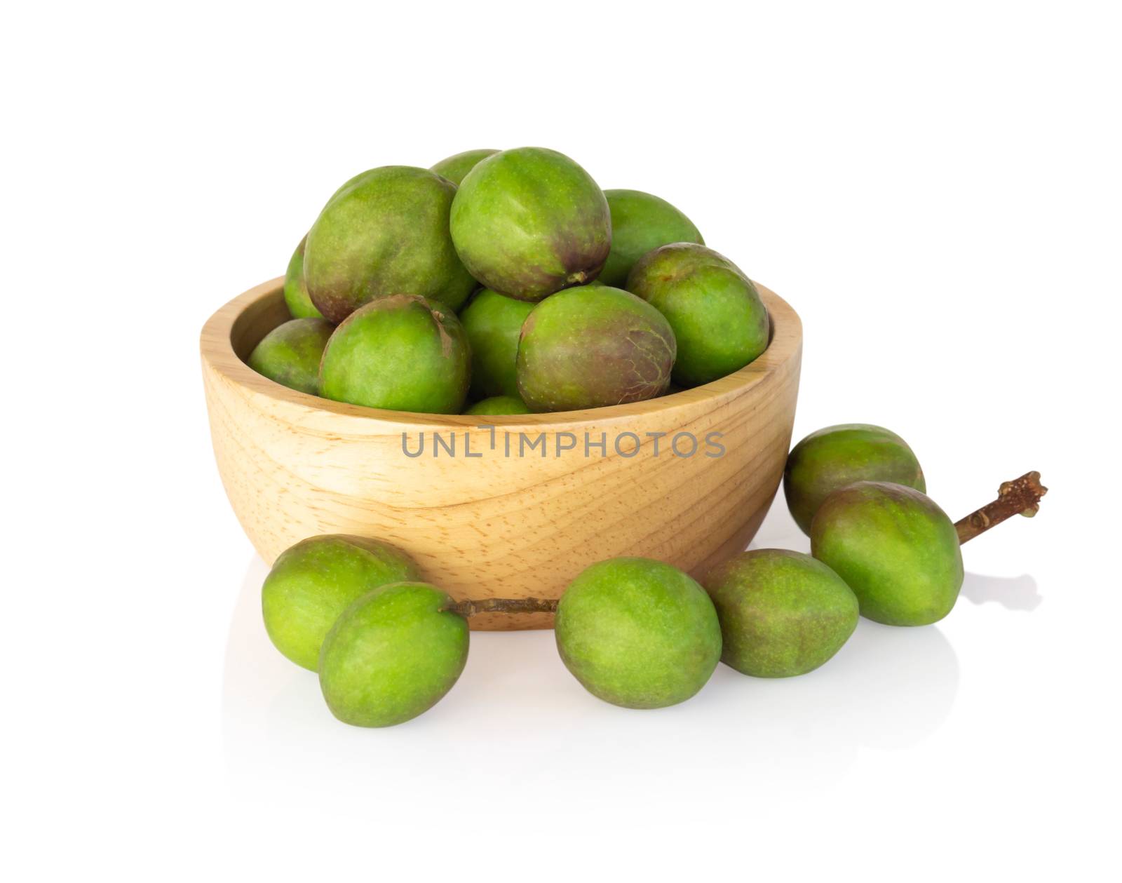 Chebulic Myrobalans in wood bowl isolated on white background, herb and medical
