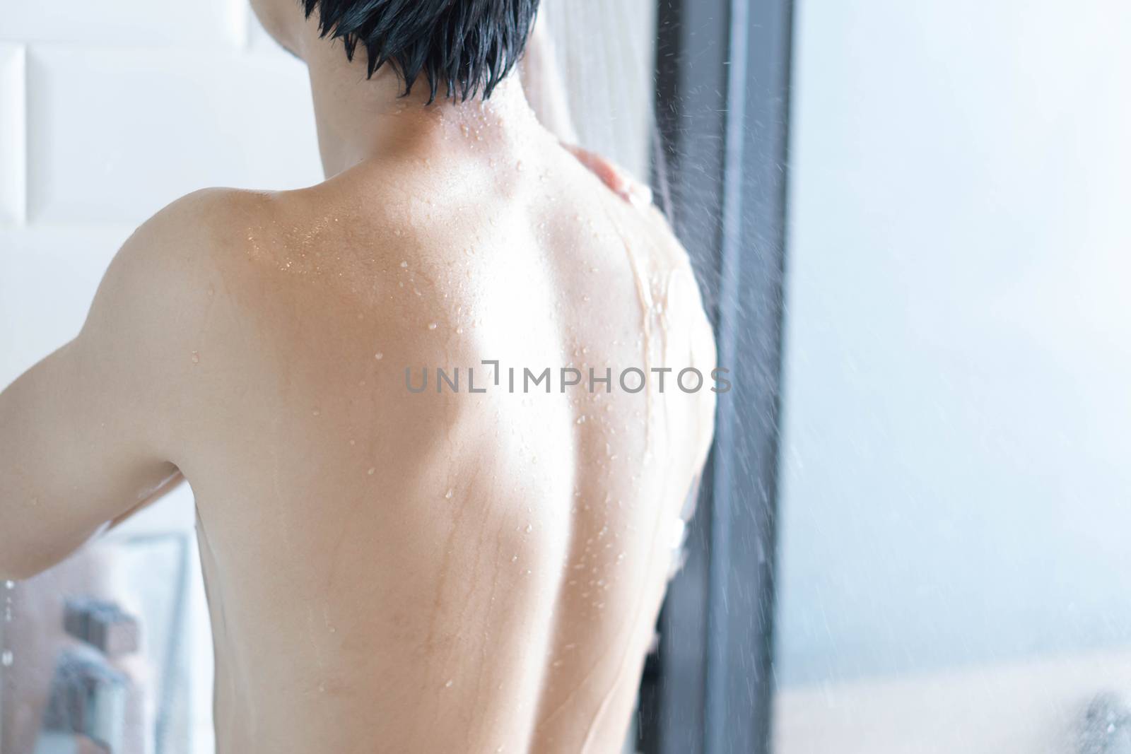 Closeup handsome asian man taking a shower in the bathroom, sele by pt.pongsak@gmail.com