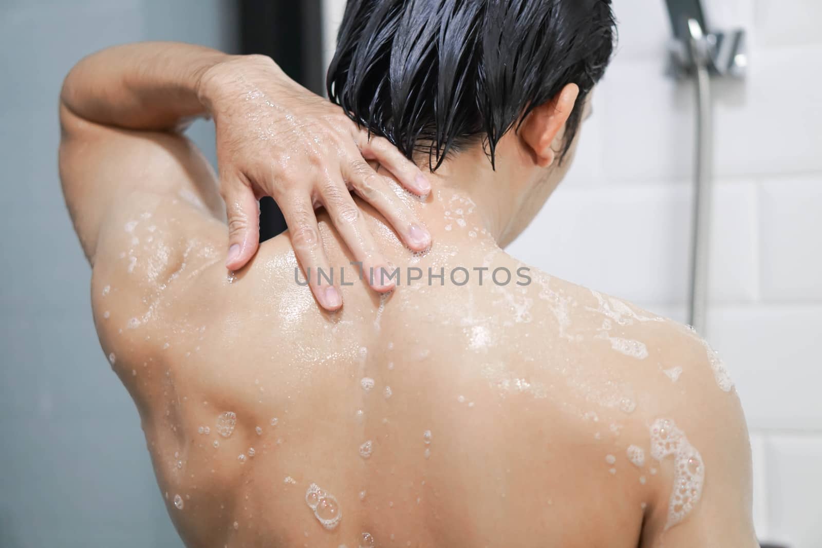 Closeup handsome asian man taking a shower in the bathroom, sele by pt.pongsak@gmail.com