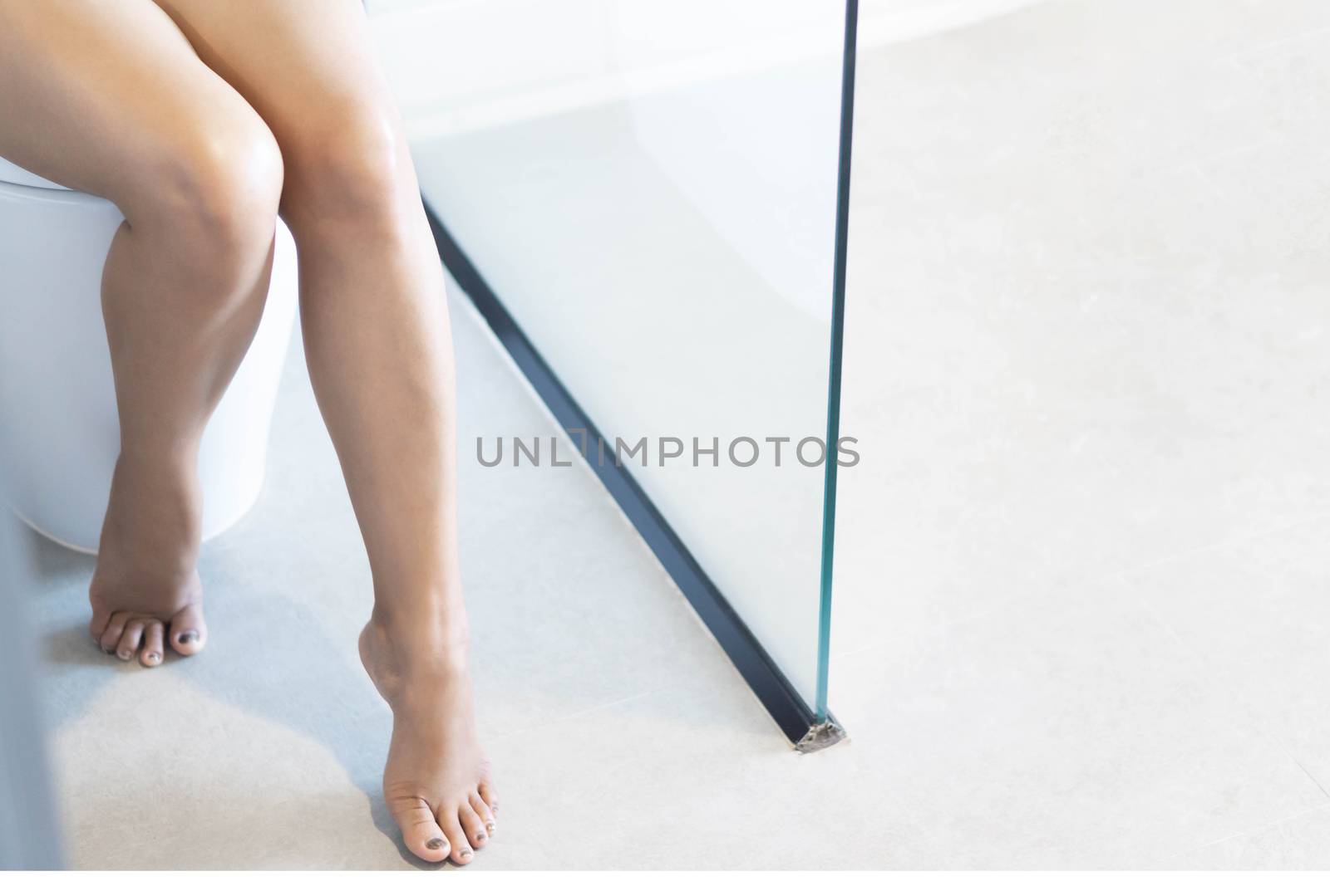 Close up woman stomachache with toilet in the morning, health care concept, selective focus
