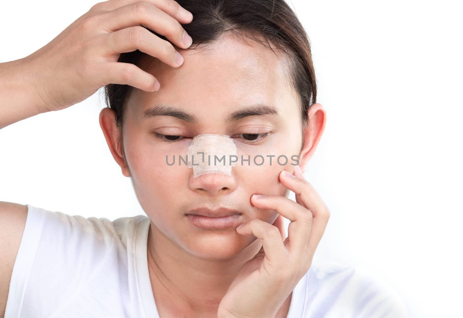 Close up face of asian woman with nose plastic surgery for beauty and cosmetic conept, white background