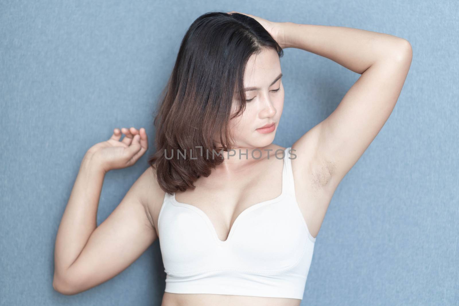 Women problem black armpit with grey background for skin care and beauty concept, selective focus