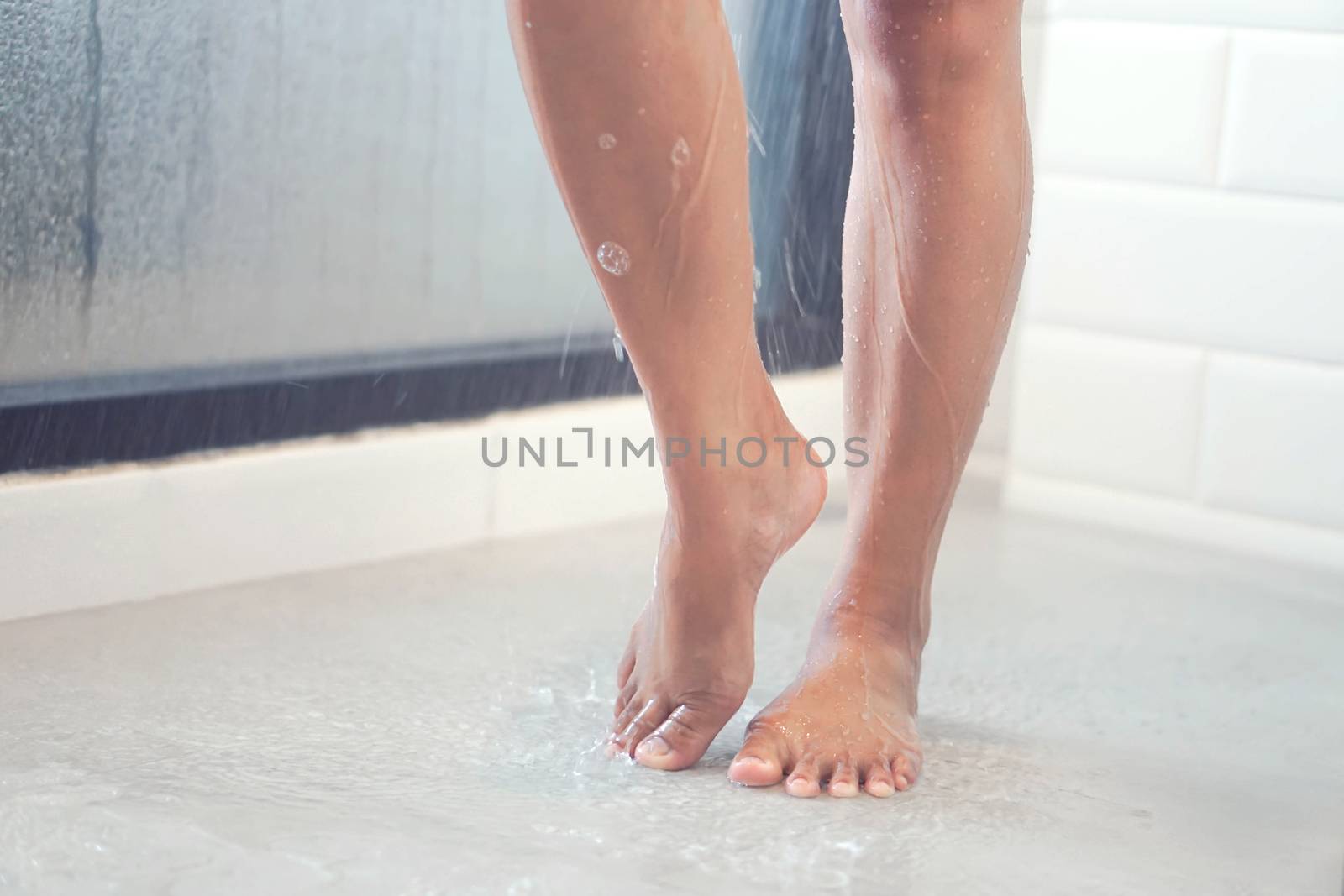 Close up woman legs with taking a shower in the bathroom, health care and beauty