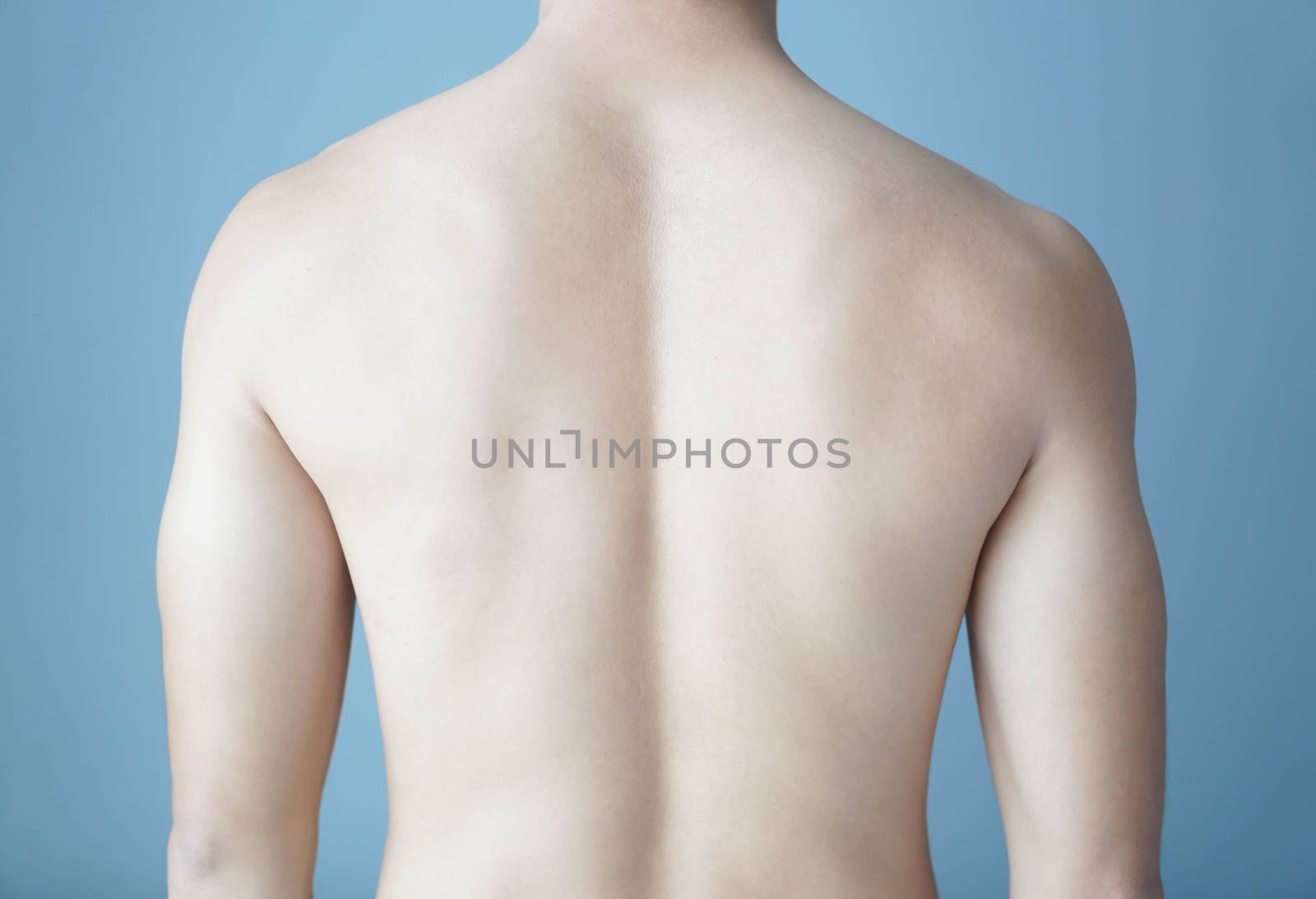 Back of man on blue background, beauty healthy skin care for men by pt.pongsak@gmail.com