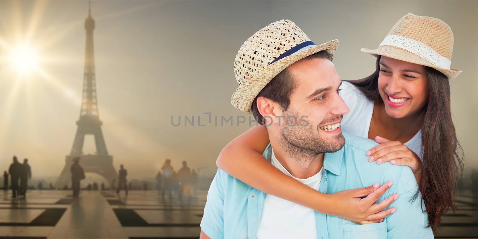 Composite image of happy casual man giving pretty girlfriend piggy back by Wavebreakmedia
