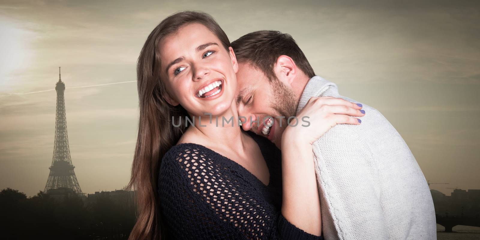 Close up of happy young couple against eiffel tower