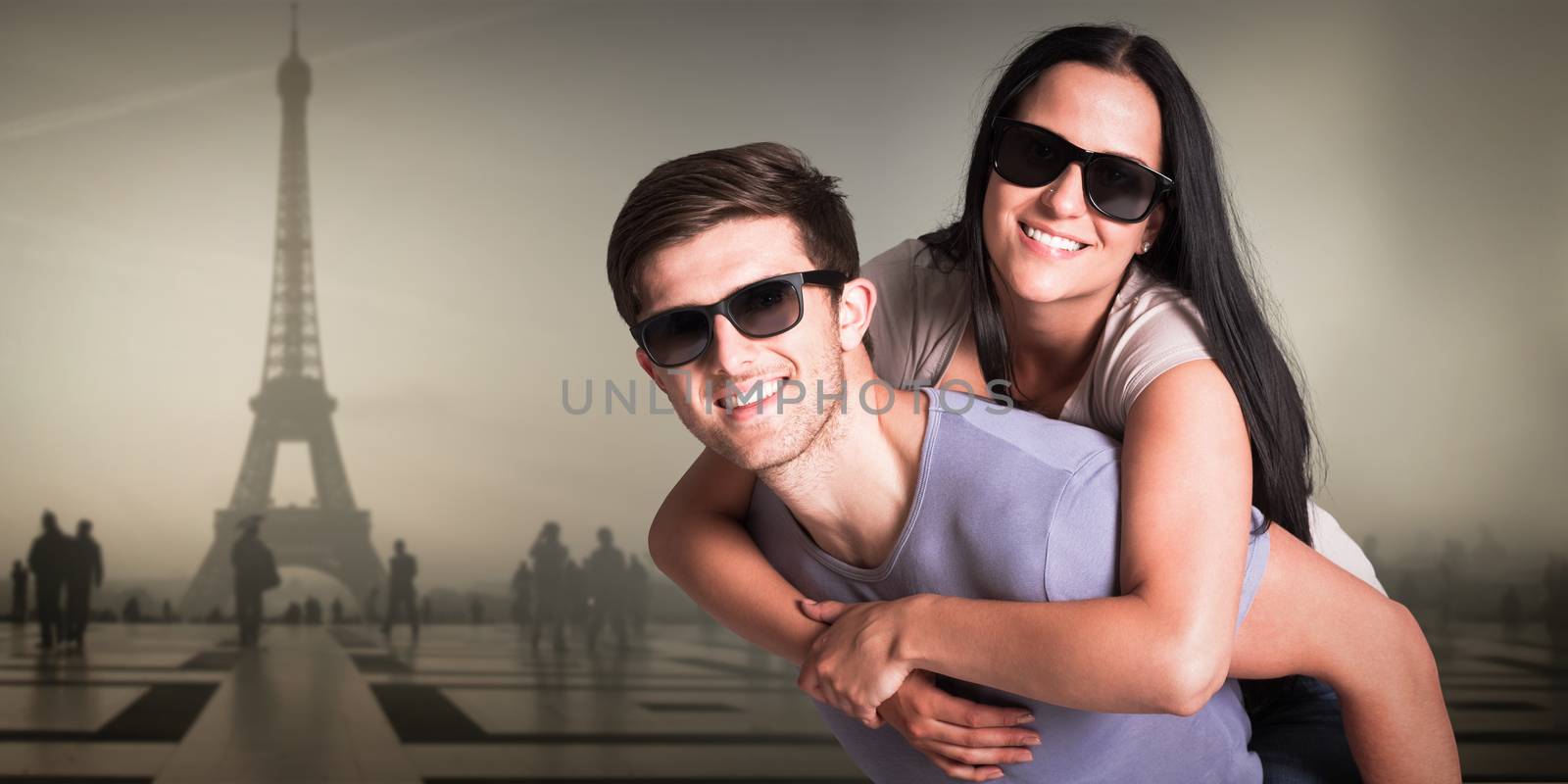 Composite image of man giving his pretty girlfriend a piggy back by Wavebreakmedia