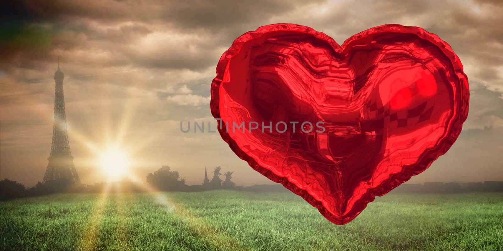 Red heart balloon against paris under cloudy sky