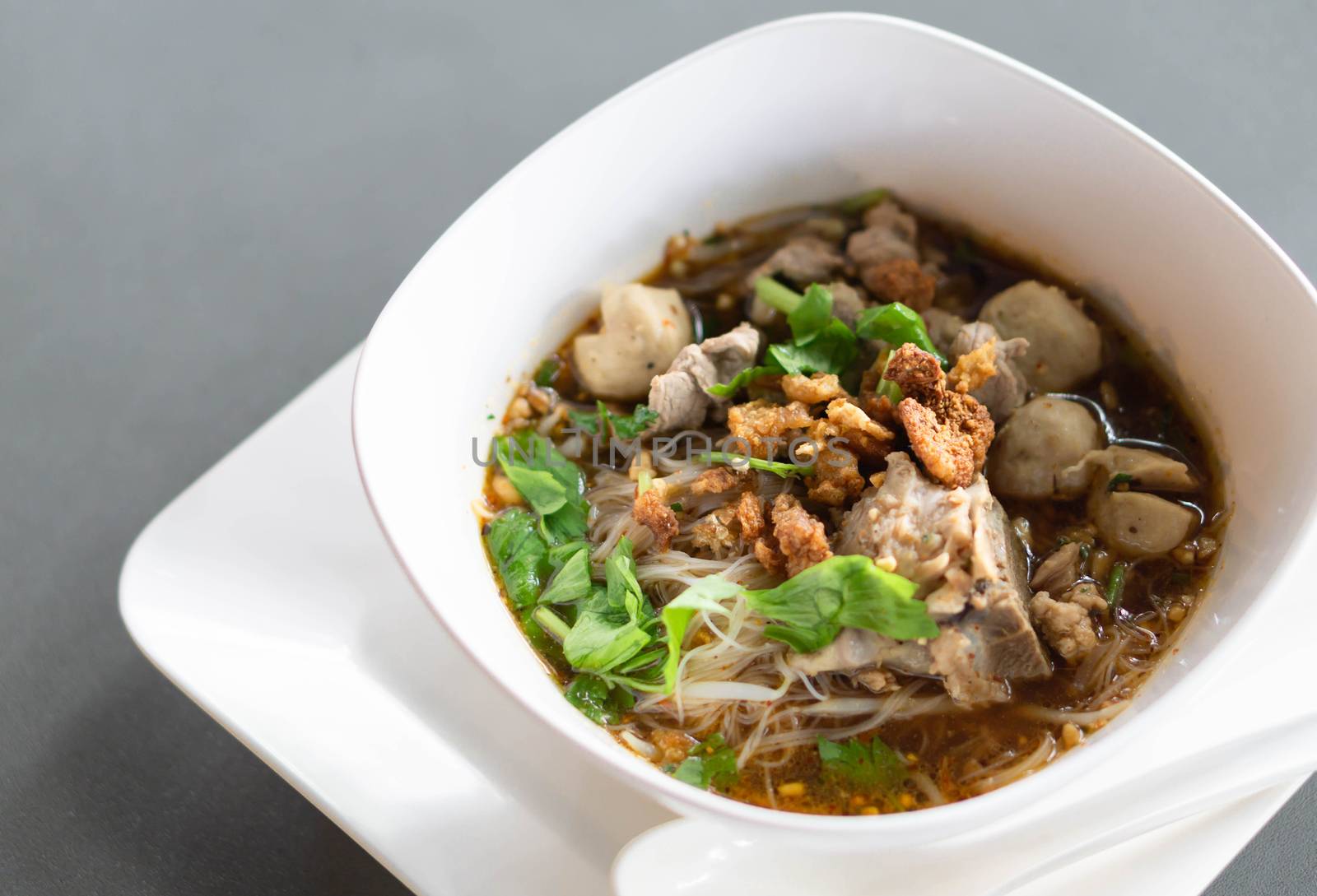 Rice noodle soup with Cooked Liver in  bowl on table, selective focus