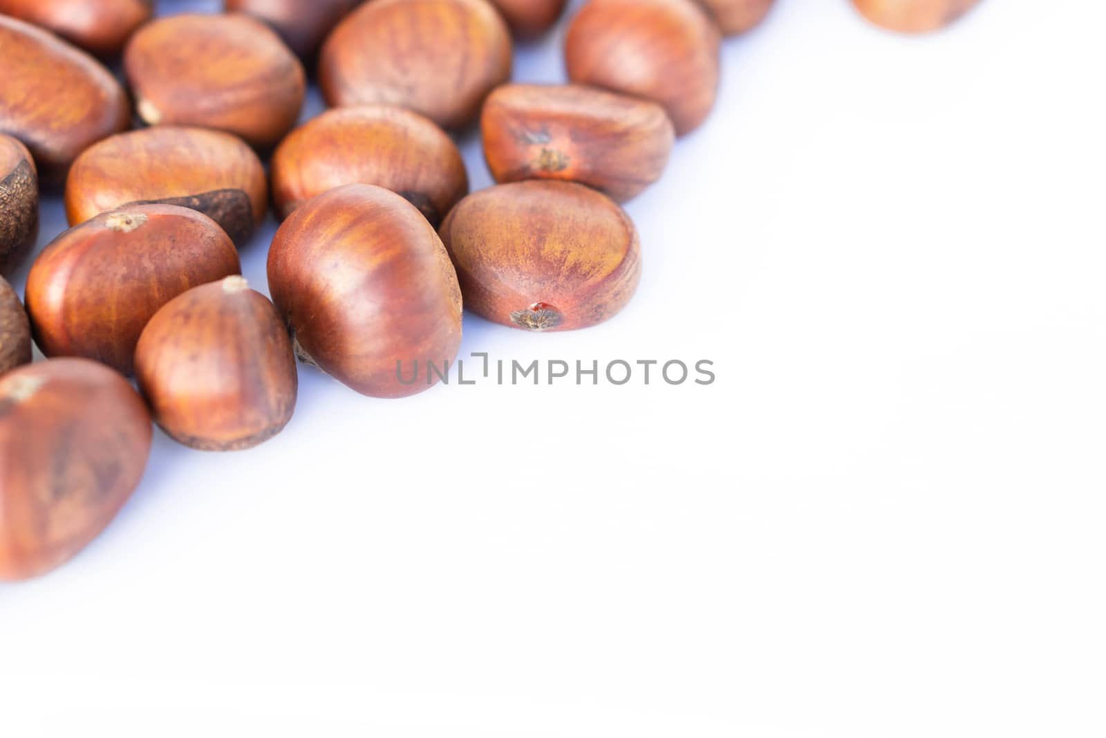 Closeup horse chestnuts isolated on white background,  healthy food concept