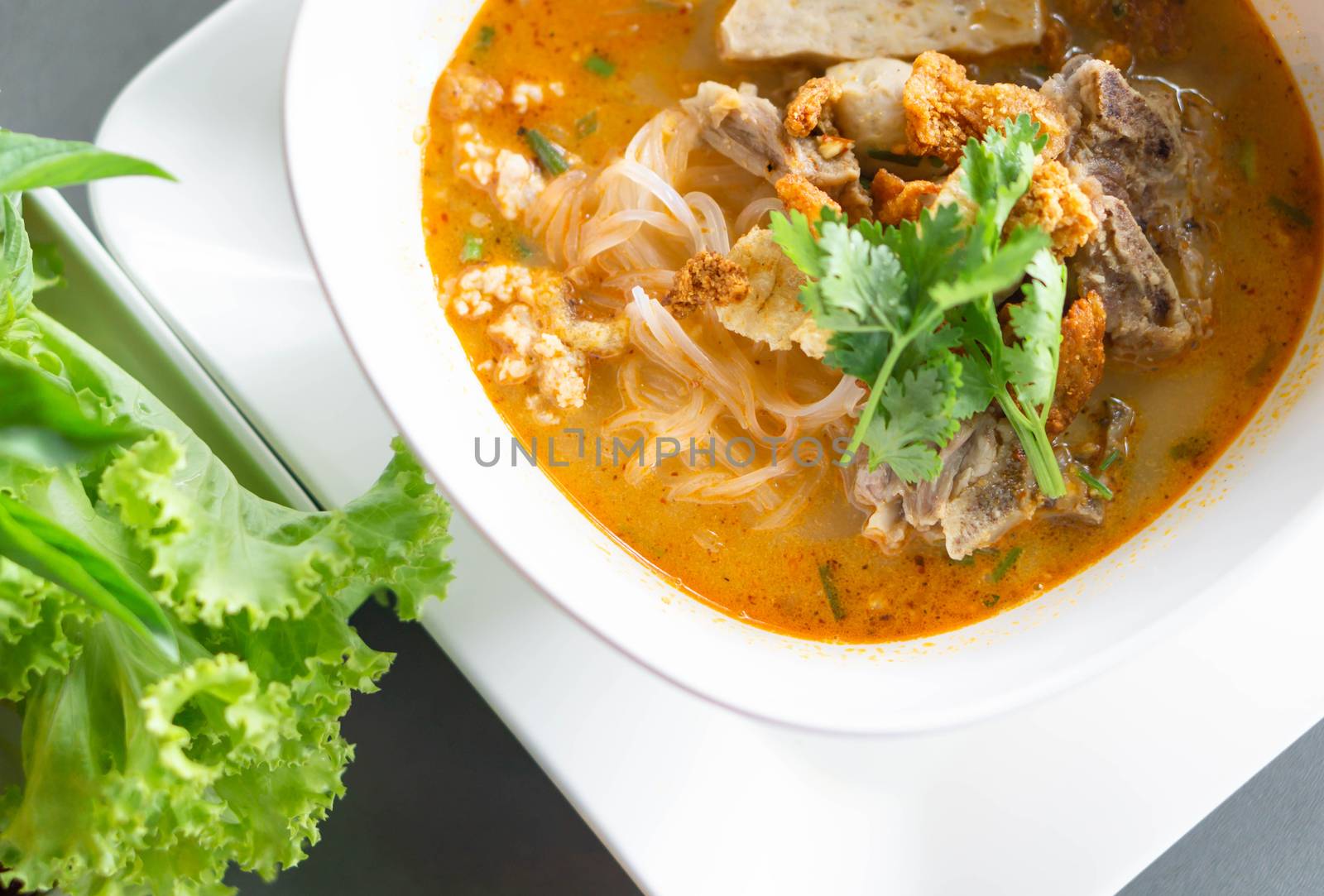 Rice noodle soup with Cooked Liver in  bowl on table, selective focus