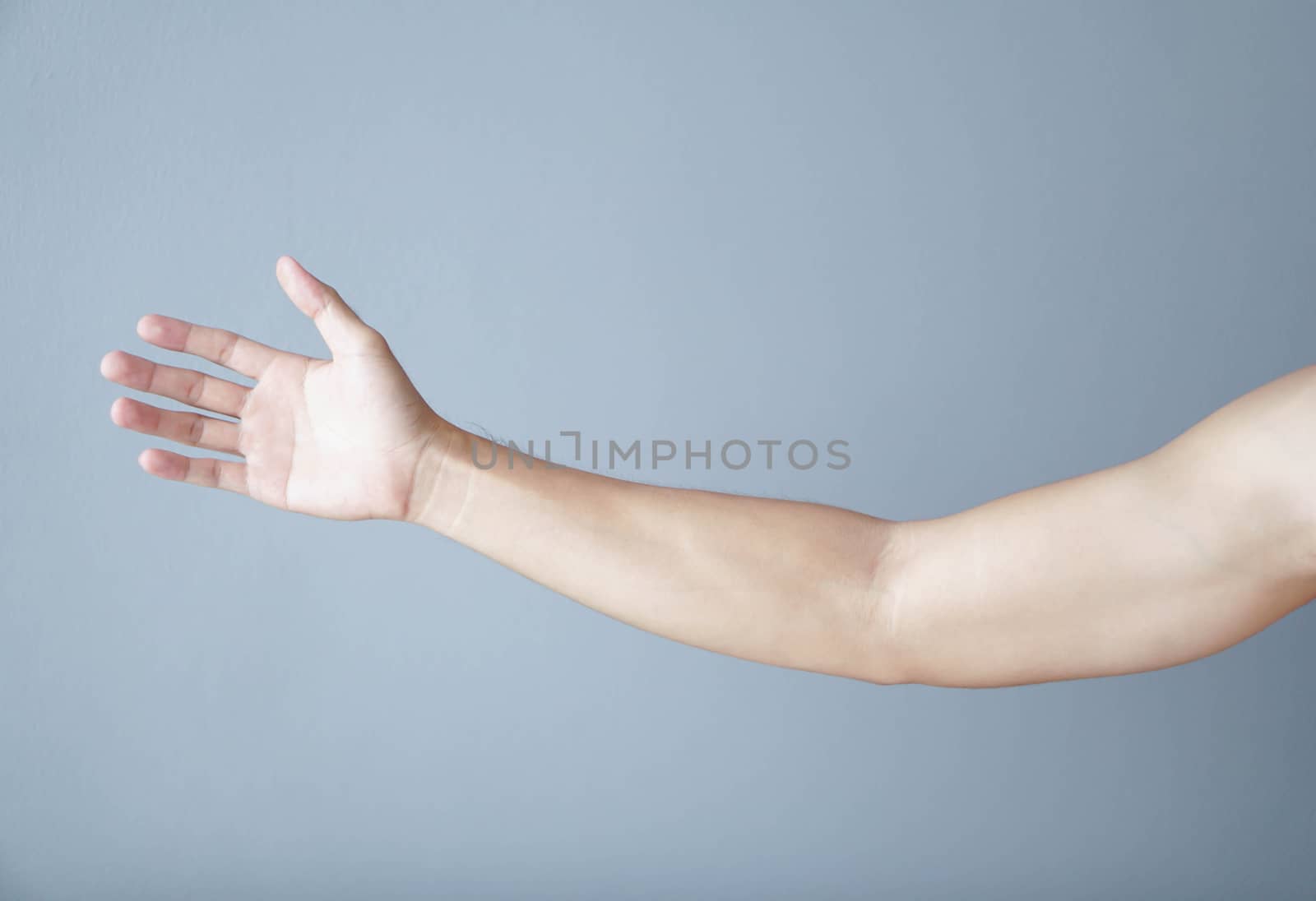 Close up man hand with grey background, health care concept by pt.pongsak@gmail.com