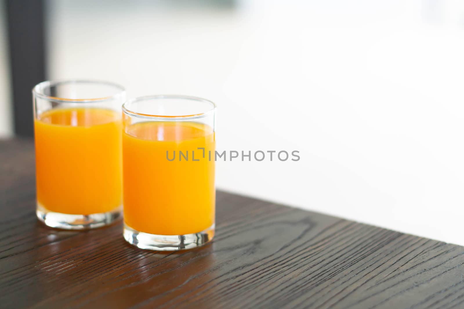 Closeup orange juice on wood table, drink for healthy concept, selective focus