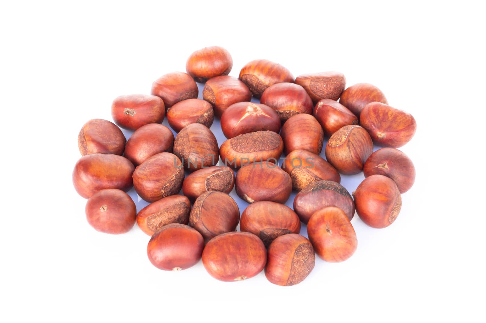 Closeup top view horse chestnuts isolated on white background,  healthy food concept