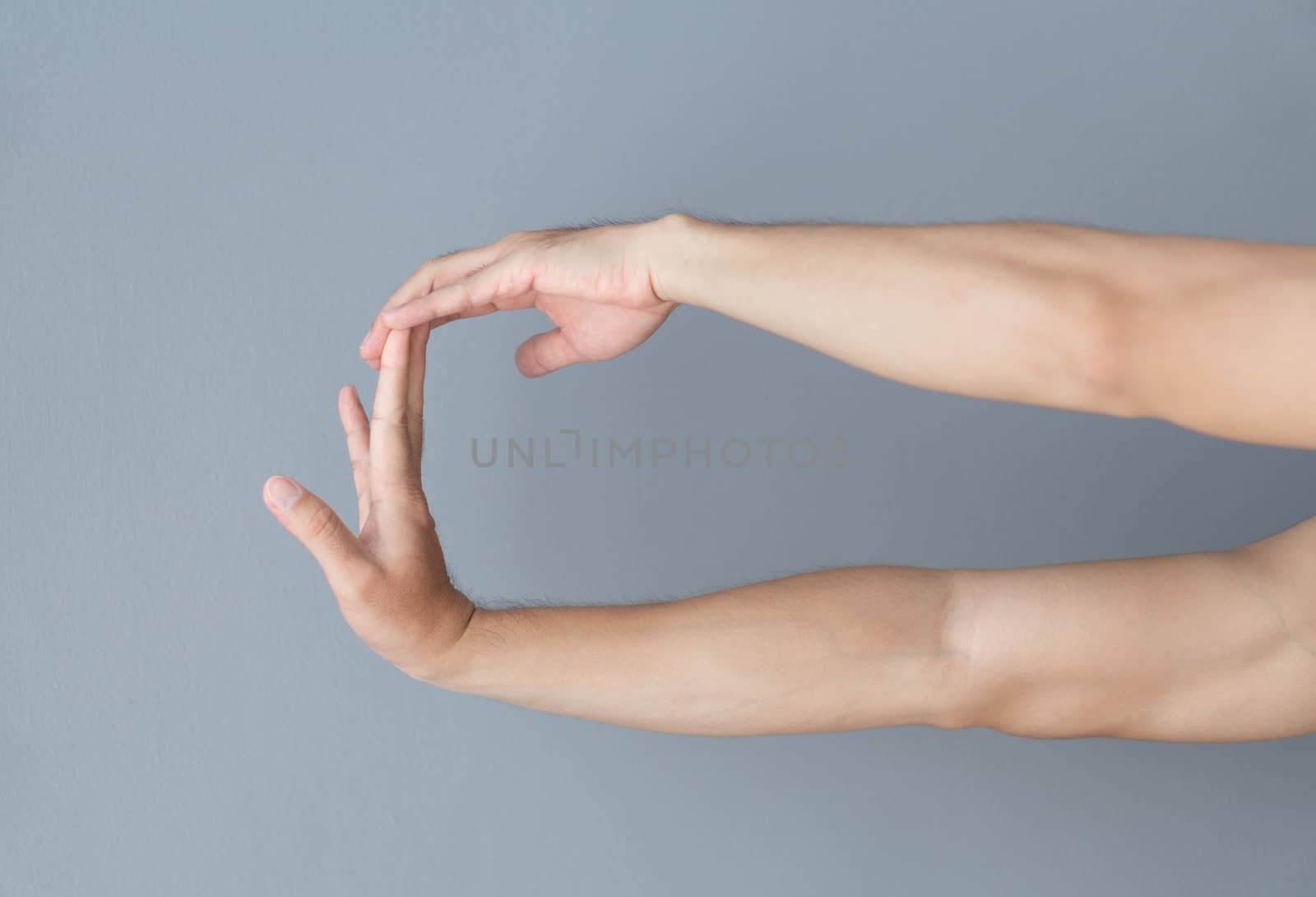 stretching exercises finger on grey background, health care and medical concept