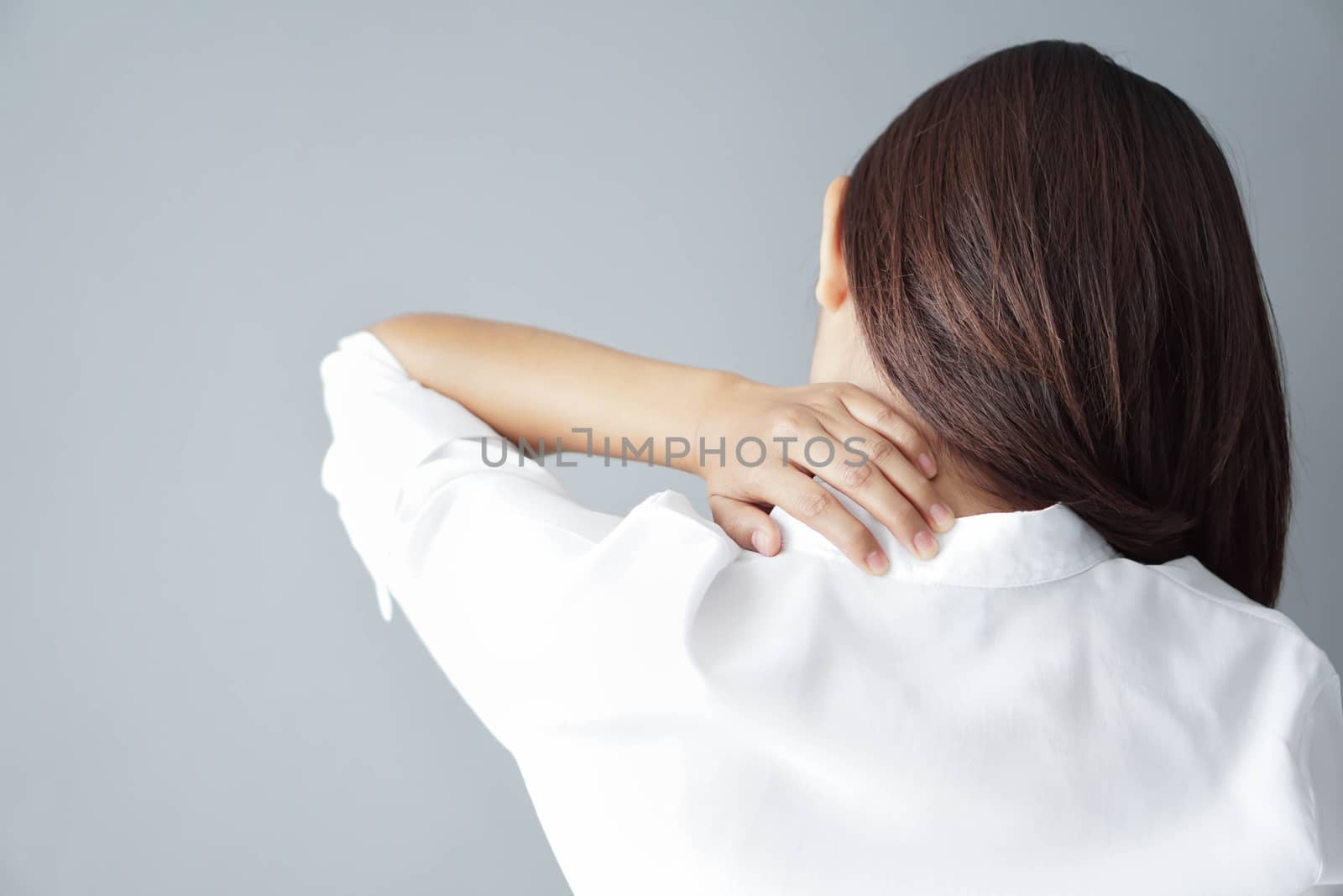 Closeup woman holding neck with pain, healthy care and medical c by pt.pongsak@gmail.com