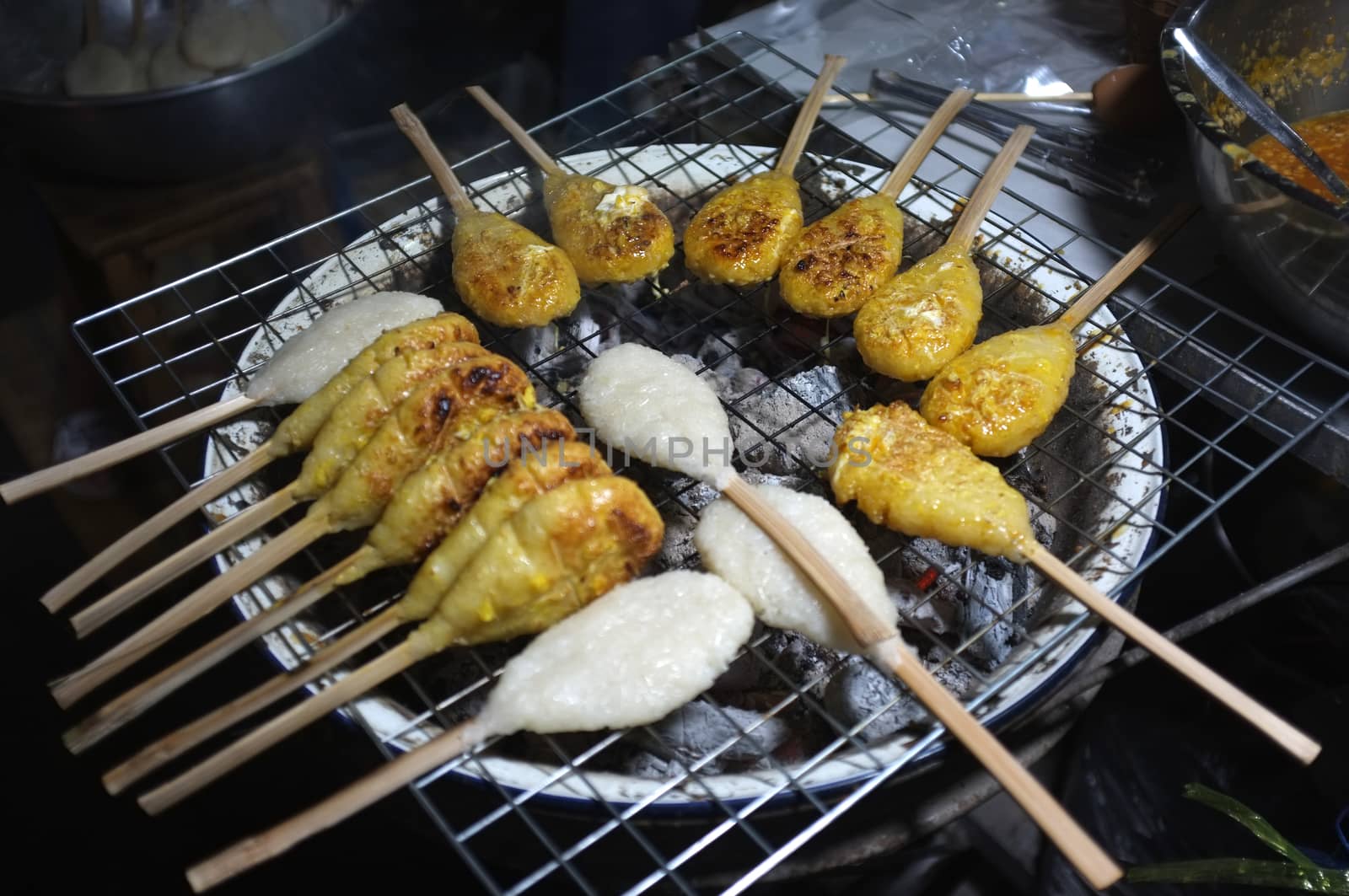 Grilled rice ball or Khao Jee: grilling yellow sticky rices, Thai style grilling 