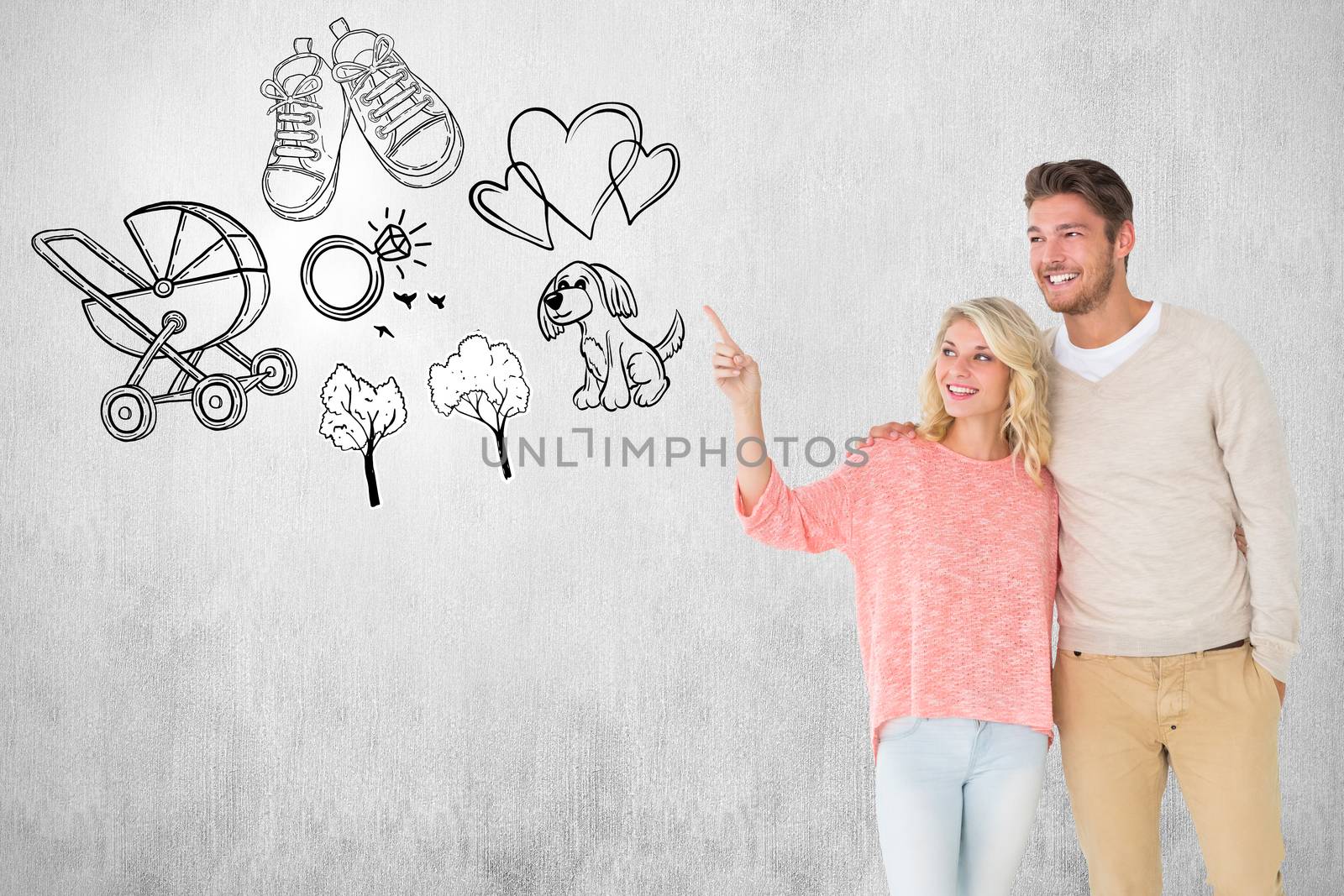 Attractive couple smiling and walking against white and grey background
