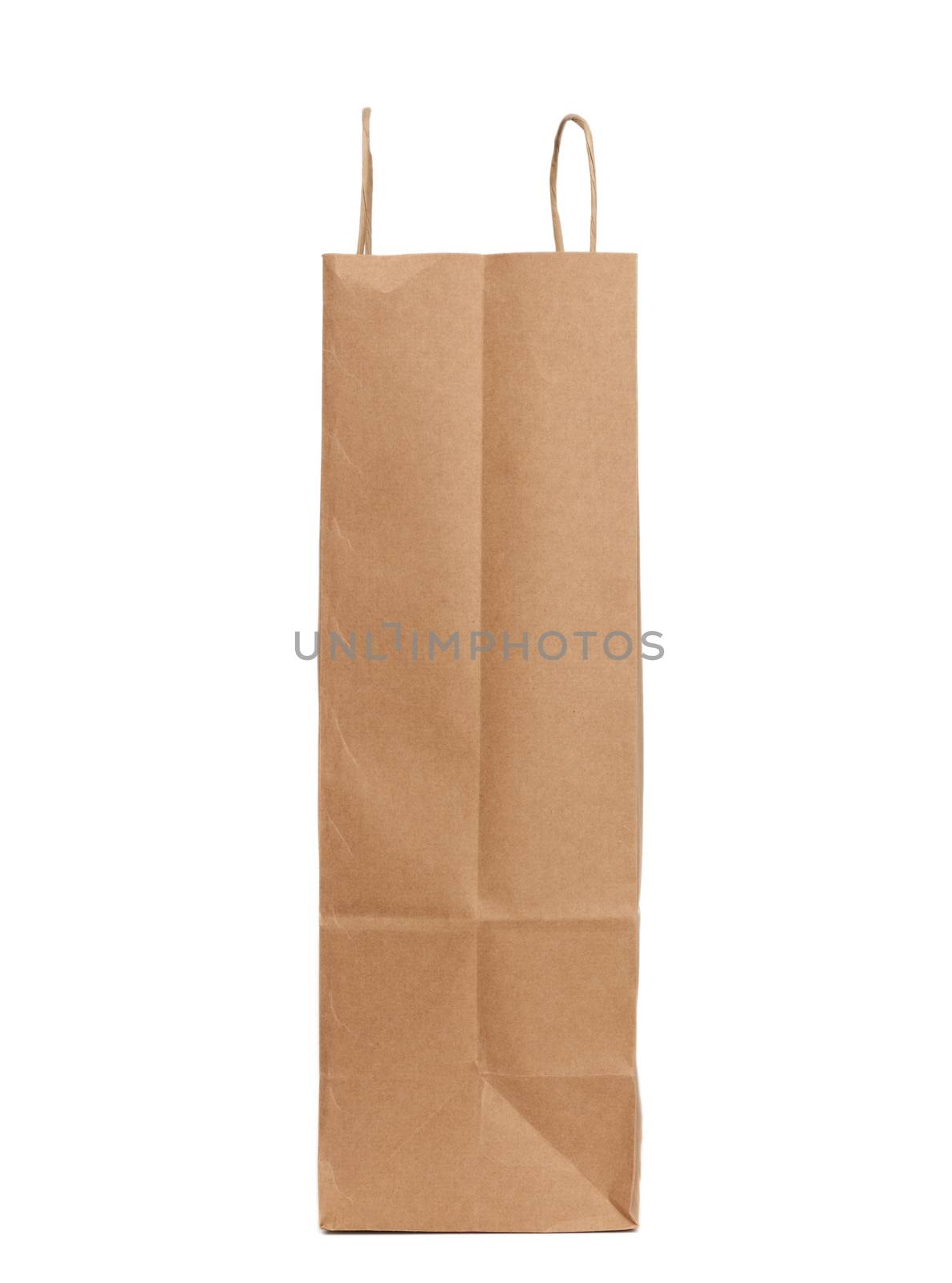 disposable brown craft paper bag with handles isolated on a white background